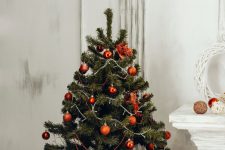 green christmas tree with orange bauble